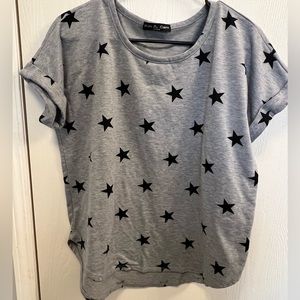 Gray tee shirt with black stars.